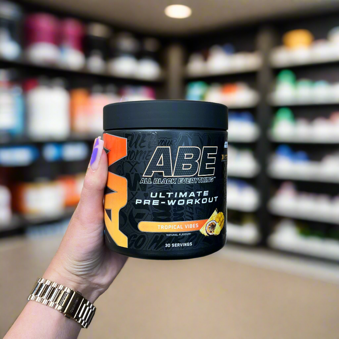 Close-up of (Applied Nutrition ABE Ultimate Preworkout 315g) held up inside My Supplement Shop, clearly showing the front label in a Sports Nutrition setting.