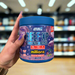 Close-up of (Applied Nutrition Beef-XP 150g) held up inside My Supplement Shop, clearly showing the front label in a Sports Nutrition setting.