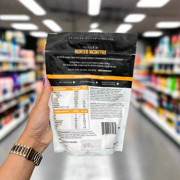 Close-up of (BLDR Sports Hydro 360g) held up inside My Supplement Shop, clearly showing key ingredients on the packaging in a Sports Nutrition setting.